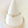 Pulsera 6 bolitas regulable oro 18k